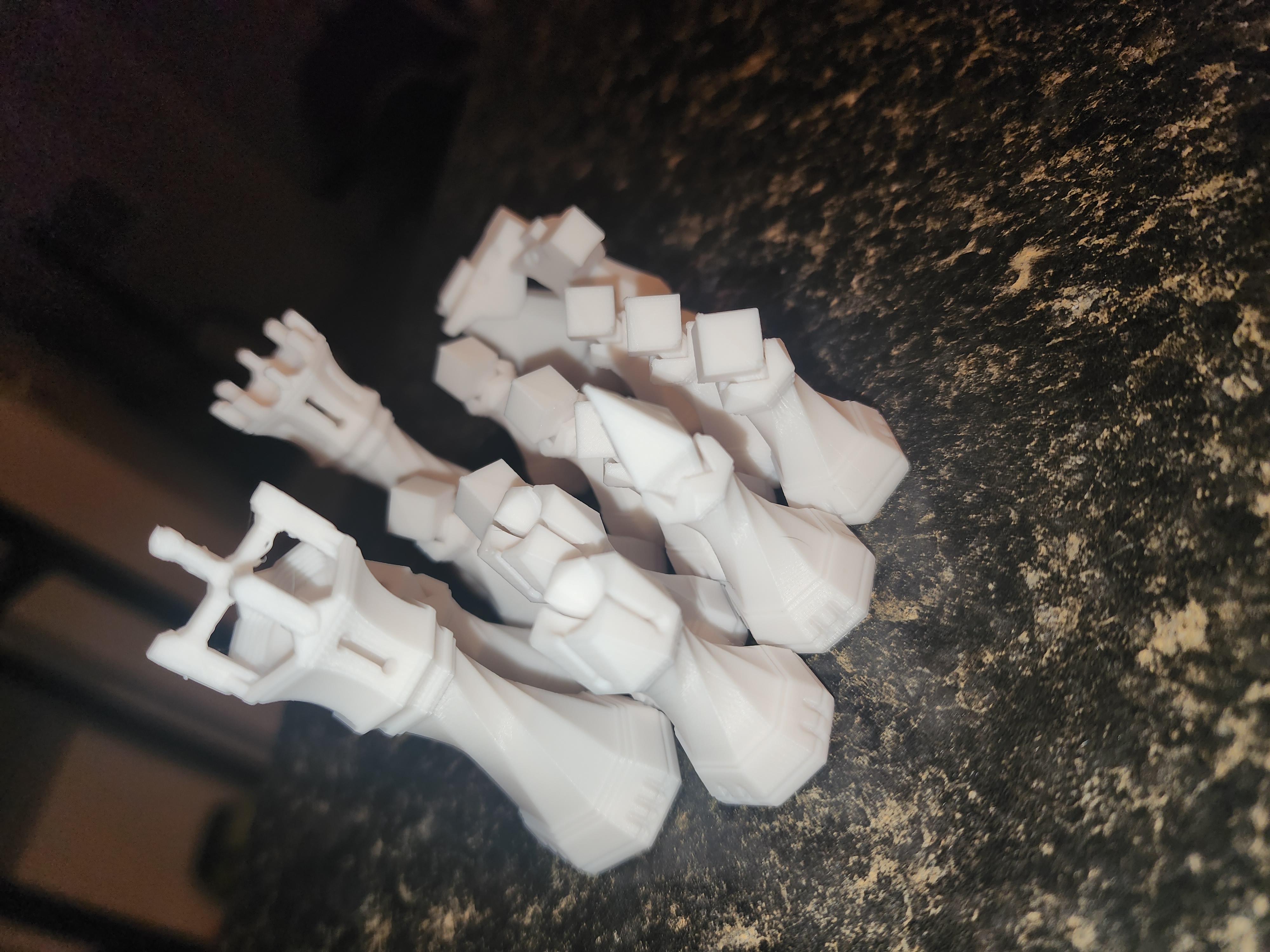 Full set of white geometric low-poly 3D printed chess pieces