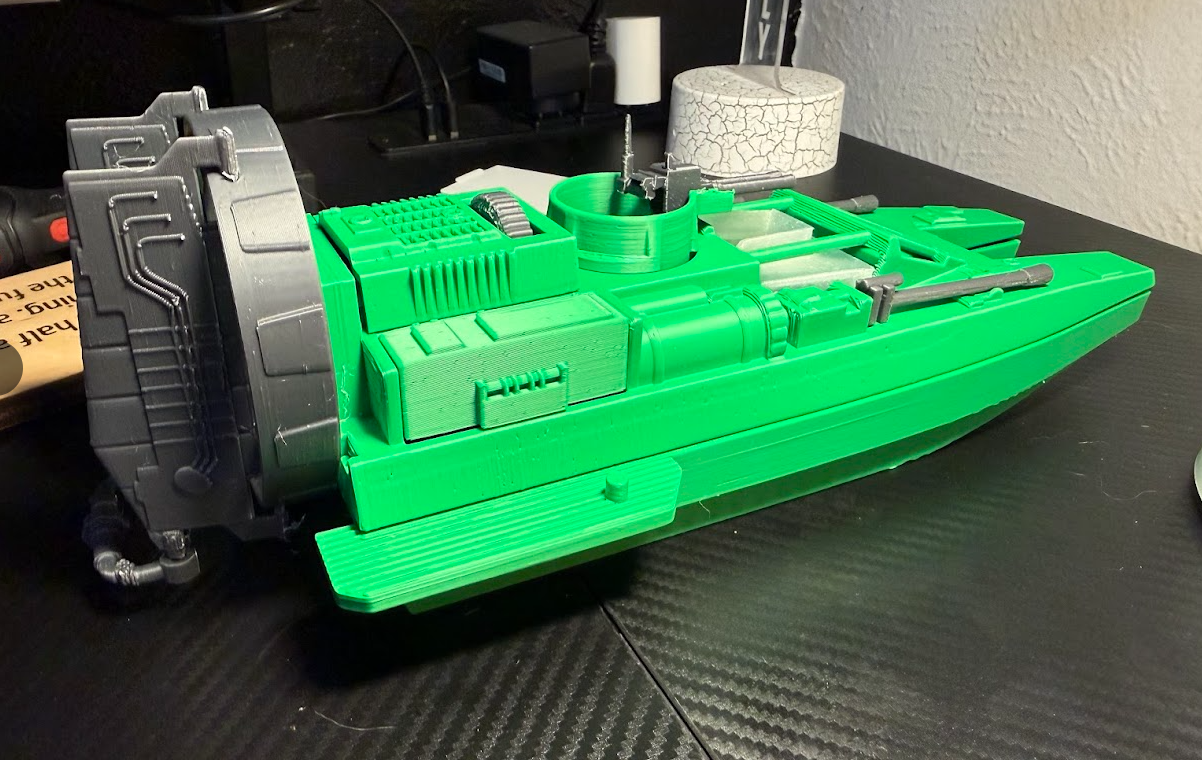 Green 3D printed military assault gunboat model with gun turrets